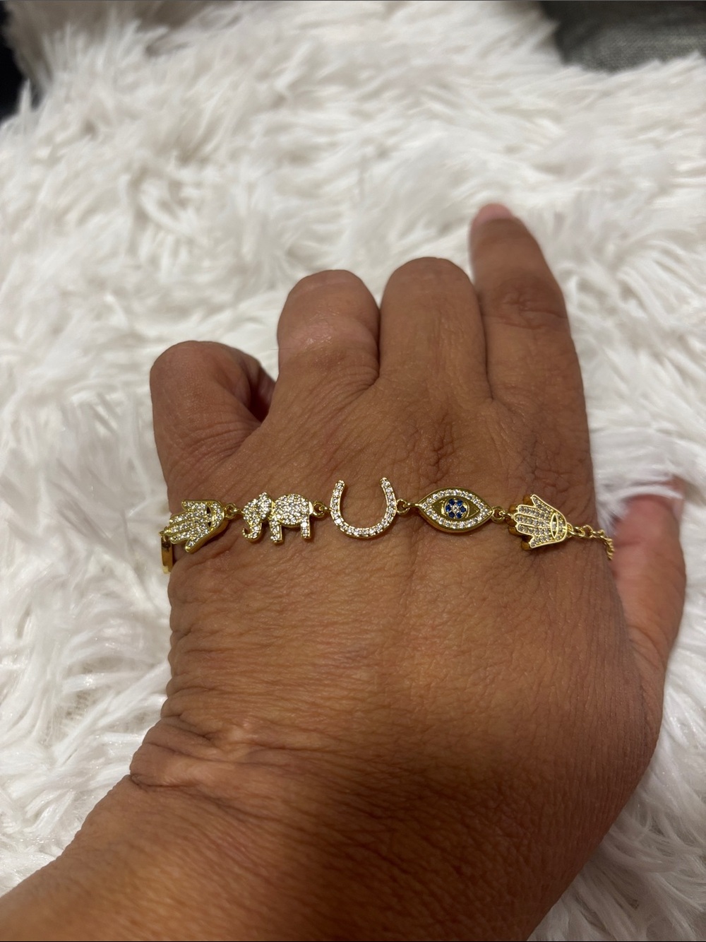 Gold Tone Charm Bracelet with Elephant, Hamsa & Evil Eye